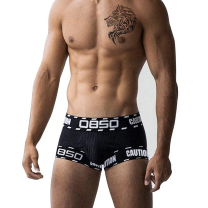 Daily wear|Gym sessions|Holiday parties|Pride events|Night gatherings|Breathable|Butt-lift design|Comfort|Proper support|Stylish appearance|Festive mood|Men's trunks|Low-rise underwear|Caution trunks|Sexy trunks|Black|Front view