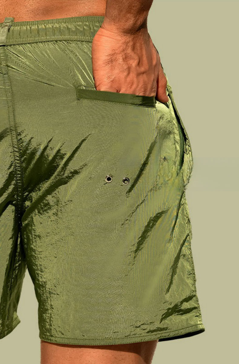 Detail view of DESMIIT Double Layer Swim Trunks with Quick Dry feature in Green.