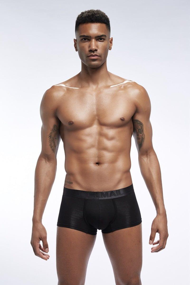 Daily wear|Gym sessions|Holiday parties|Pride events|Night gatherings|Breathable|Butt-lift design|Snug fit|Lightweight|Shaping|Waistline control|Slimming|Abdomen control|Comfort|Proper support|Stylish appearance|Festive mood|Body sculpting|Men's trunks|Low-rise underwear|Polyester pouch trunks|Core design trunks|Sexy trunks|Black|Front view