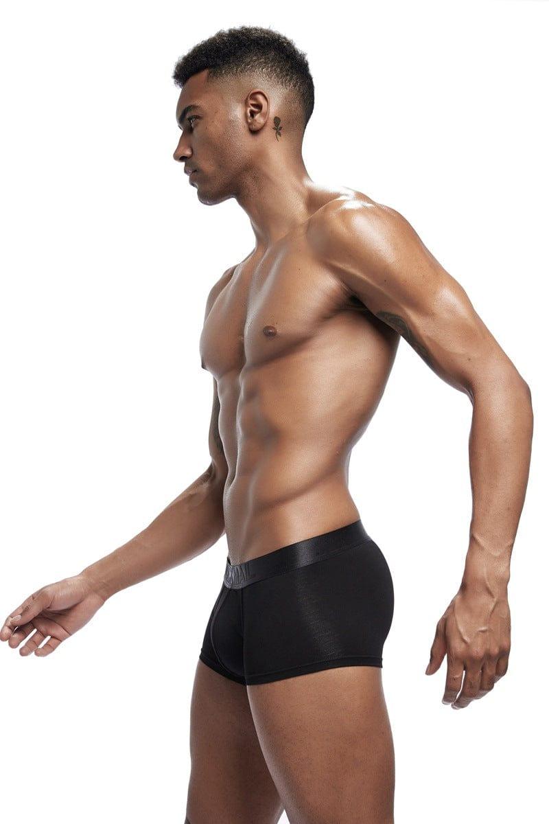 Daily wear|Gym sessions|Holiday parties|Pride events|Night gatherings|Breathable|Butt-lift design|Snug fit|Lightweight|Shaping|Waistline control|Slimming|Abdomen control|Comfort|Proper support|Stylish appearance|Festive mood|Body sculpting|Men's trunks|Low-rise underwear|Polyester pouch trunks|Core design trunks|Sexy trunks|Black|Left Side view