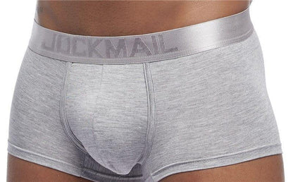 Daily wear|Gym sessions|Holiday parties|Pride events|Night gatherings|Breathable|Butt-lift design|Snug fit|Lightweight|Shaping|Waistline control|Slimming|Abdomen control|Comfort|Proper support|Stylish appearance|Festive mood|Body sculpting|Men's trunks|Low-rise underwear|Polyester pouch trunks|Core design trunks|Sexy trunks|Gray|Front view3