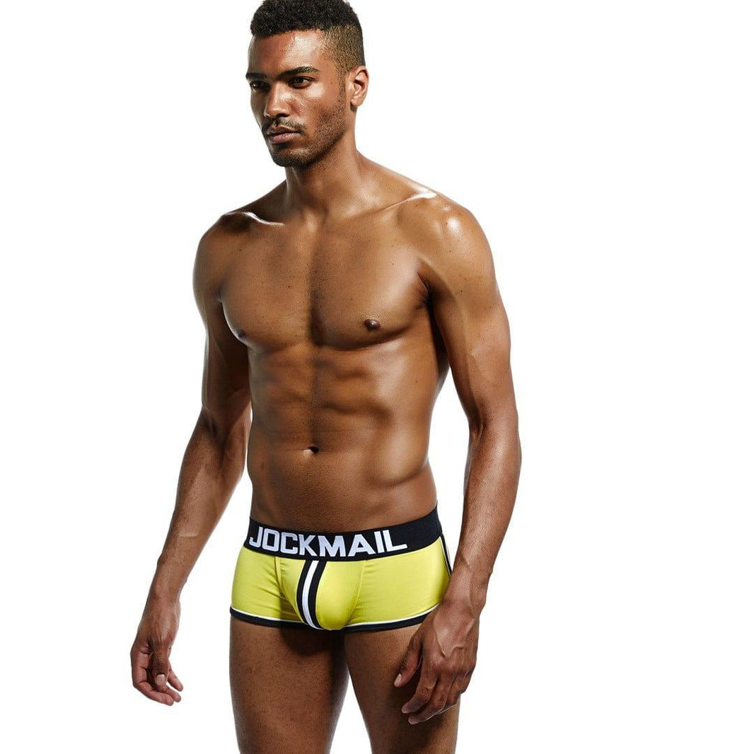Daily wear|Gym sessions|Holiday parties|Pride events|Night gatherings|Breathable|Butt-lift design|Snug fit|Lightweight|Shaping|Waistline control|Slimming|Abdomen control|Comfort|Proper support|Stylish appearance|Festive mood|Body sculpting|Men's trunks|Low-rise underwear|Polyester pouch trunks|Sexy trunks|Open-back trunks|Yellow|Left Side view