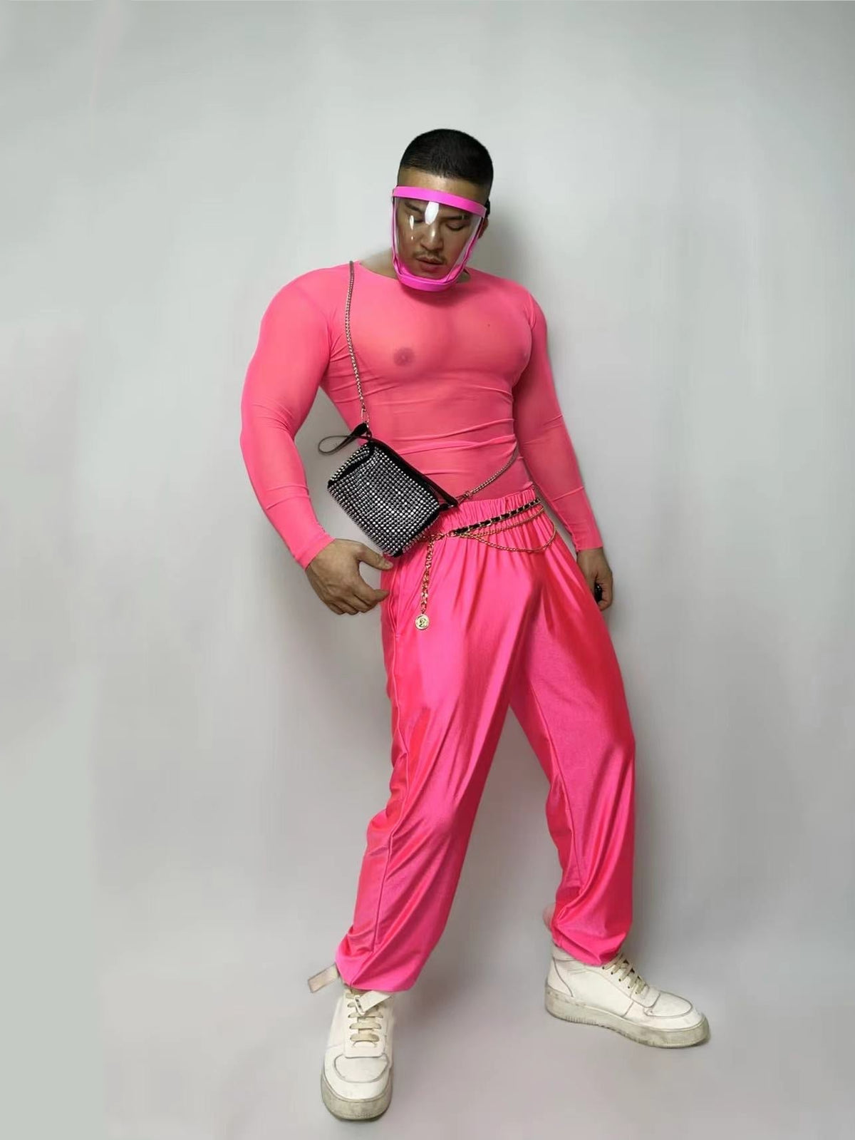 Front view of the pink fluorescent mesh top and pants set